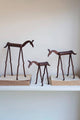 SET OF THREE FORGED-IRON HORSES